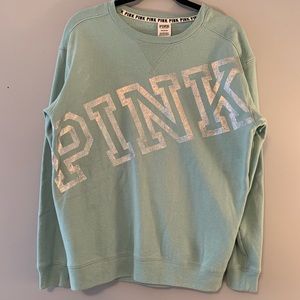 PINK crewneck sweatshirt.